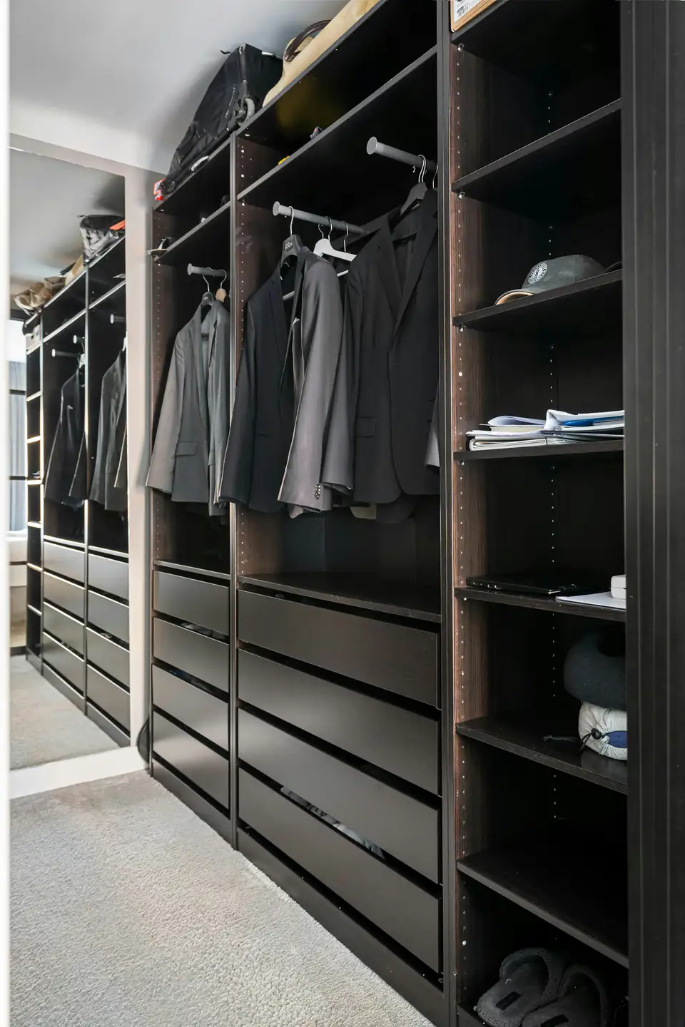 Black wardrobe interior with drawers | Fitted wardrobes Newcastle Black wardrobe interior with drawers and hanging jackets, a storage idea for homes in Newcastle